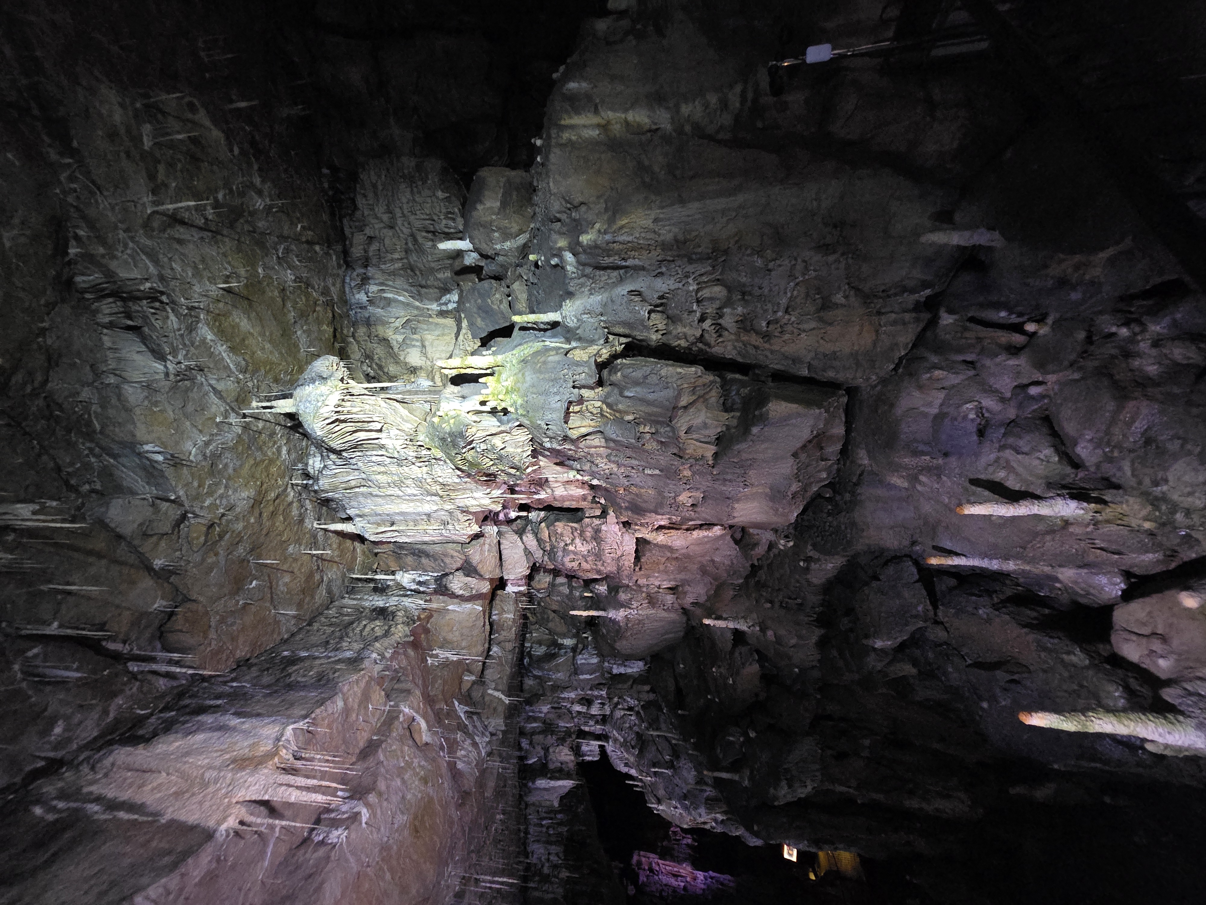 Inside cave with stalactites and stalagmites