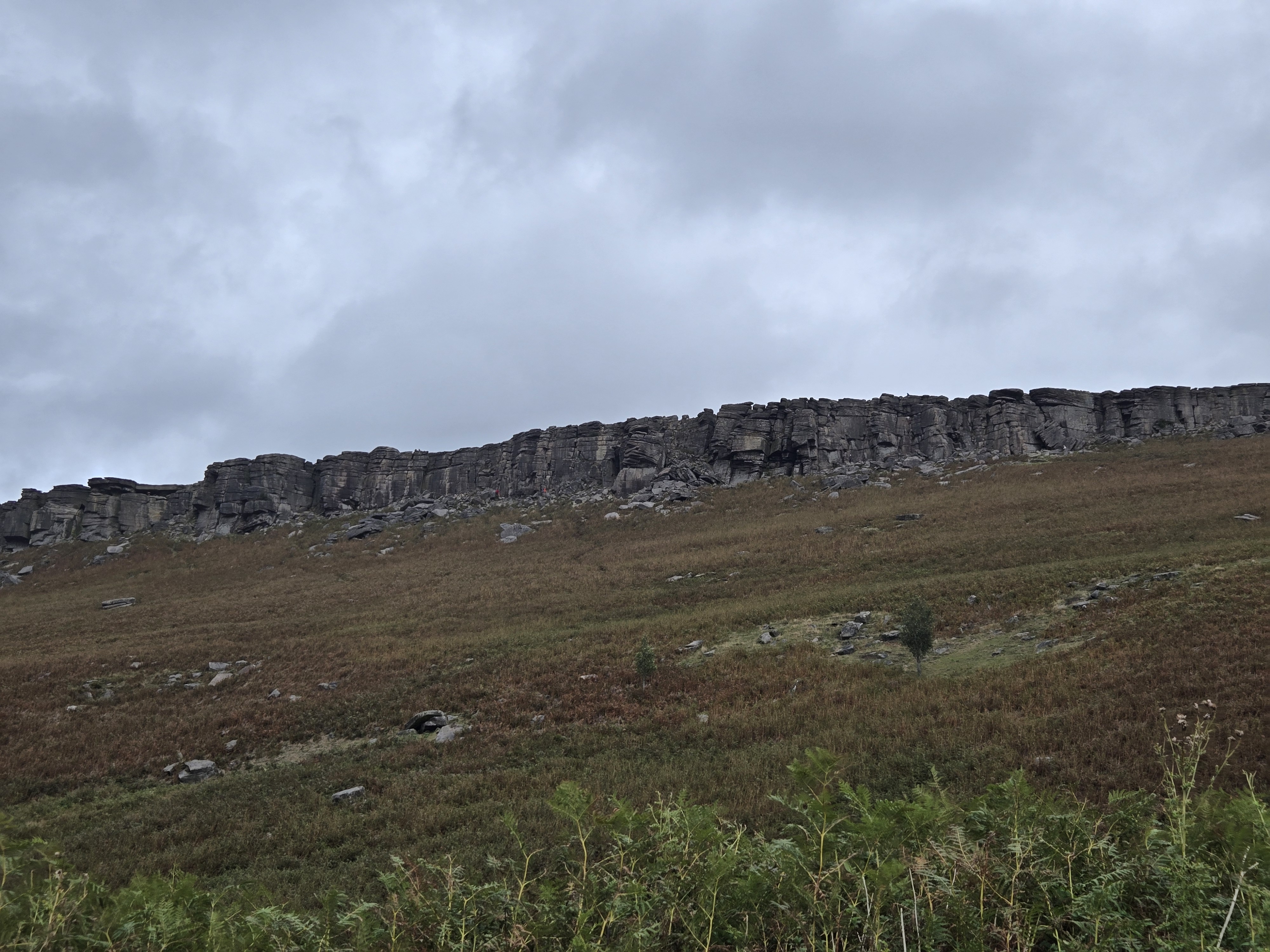 Rocky outcrop running along ridge of hill